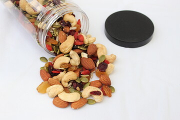 The healthy snack with ailmonds, nuts, dried grapes, pumkin seed and more of dried fruits. Focus in the middle and blurred around