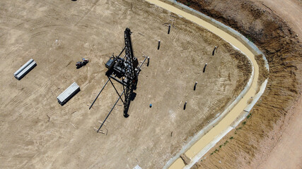 pile rig Equipment for installing piles in ground prepare for  solar farm, heavy machines for driving pillars work in laying the foundation building. Construction aerial view height from drone.