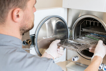 Sterilization of dentall instrument with ultraviolet lamp in dental clinic, autoclave sterilizing machine for dental tools to clean. cless B/ high quality.