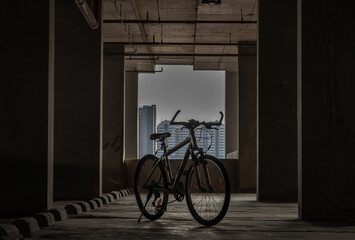 Mountain bike is parked in the empty parking lot. Copy space, Selective focus