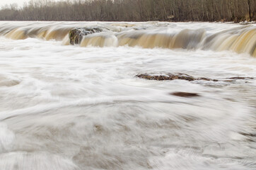 Fototapeta na wymiar Venta waterfall, the widest waterfall in Europe, in winter day, Kuldiga, Latvia.