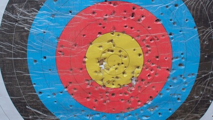 Multi-colored perforated object for children's archery. Development of the skill of accuracy, hitting the target.