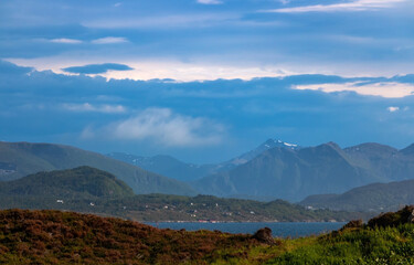 landscape with mountains and blue clouds in Norway