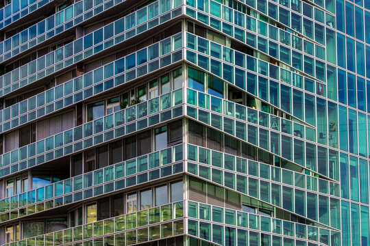 Basel, Switzerland - August 10. 2021: Details of the St. Jakob tower designed by the architects Herzog & de Meuron. It is a berg crystal shaped modern multi-purpose building for business and living.