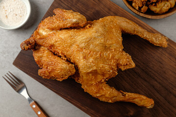 Crispy and savory deep-fried whole chicken