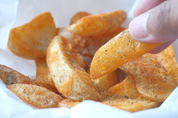 Tasty freshly made wage potato chips in a plate 