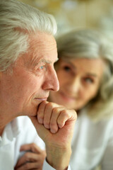 Portrait of sad senior couple