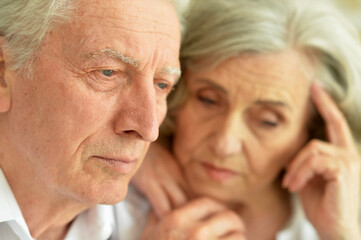 Portrait of sad senior couple