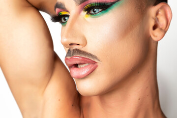 closeup of man with mustache and glamorous makeup
