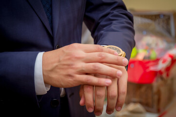 a guy in a suit watching a watch