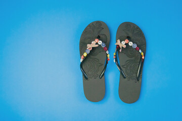 flip flops on a blue background. Beach slippers close-up