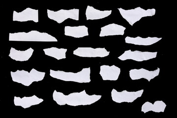 Collection of white torn paper pieces isolated on black background. Great for using as a backdrop for text or images. - obrazy, fototapety, plakaty