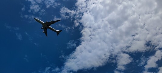 Airplane in the sky at sunrise or sunset