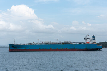 Fototapeta premium Panama Canal, cargo ship On Gatun Lake waiting to transfer Locks on her way to Atlantic Ocean. 