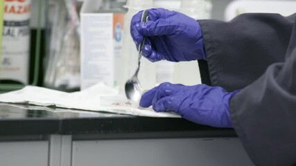 Veterinarian preparing food for a newborn animal at a zoo.