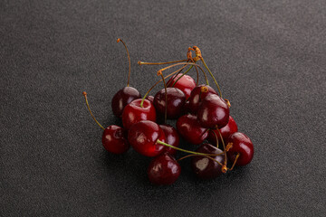 Ripe sweet cherry berries heap