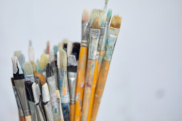 Row of artist paint brushes closeup