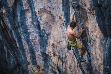 A strong man climbs a rock, Rock climbing in Turkey.