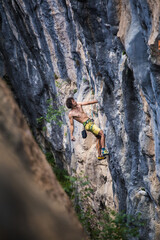 A strong man climbs a rock, Rock climbing in Turkey.