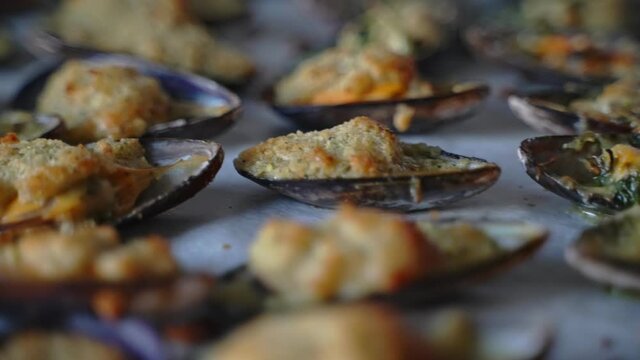 Baked stuffed fresh mussels in shell.