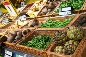 Fruit market with various colorful fresh vegetables in baskets