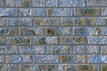 Gray texture of the brick wall of a building or structure, background.