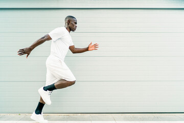 young african man training his running technique