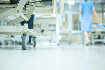 Nurses are walking to see patients and check the cleanliness of the ICU room.