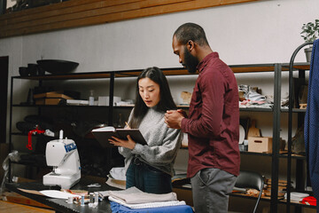 Diverse designers coworkers talking in the workshop