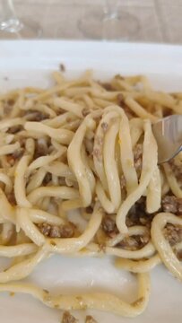 pici with ragu, stir fried noodles with white ragu bolognese
