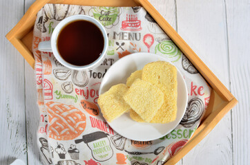 Dry bread on plate and a cup of tea