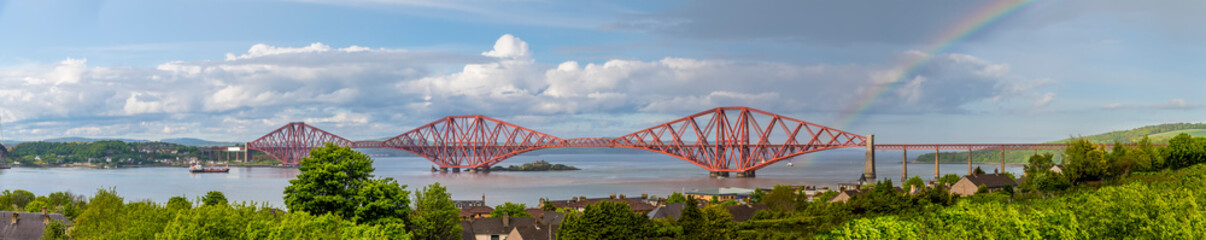 A panorma view with rainbow backlight of the Forth Railway bridge, Scotland on a summers day