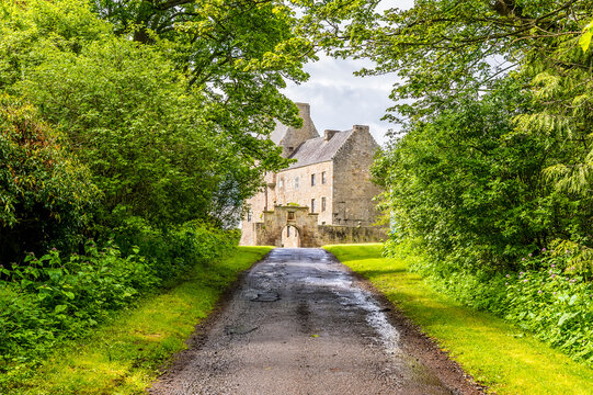 A view up a track towards Midhope castle, Scotland on a summers day