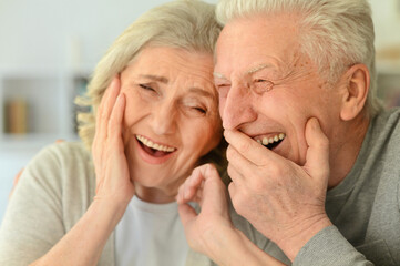 Close up portrait of happy senior couple posing