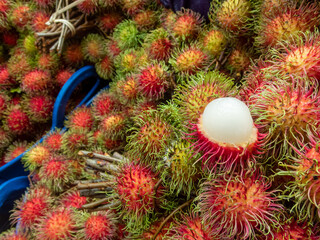 Choose focus rambutan large casing. Show off the white flesh that is firm and appetizing. Red peeled fruit from the Thai garden during the rainy season Rambutan in the fresh fruit market