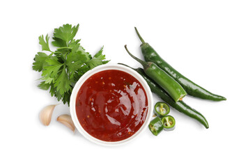 Spicy chili sauce and ingredients on white background, top view