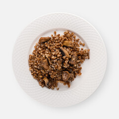 buckwheat porridge with mushrooms on a white plate