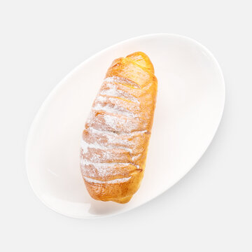 sweet fresh buns with powdered sugar on white background