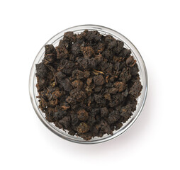 Top view of granular black tea in glass bowl