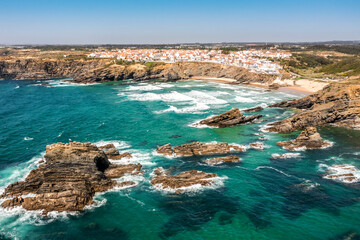 Obraz premium Aerial view of Zambujeira do Mar - charming town on cliffs by the Atlantic Ocean in Portugal