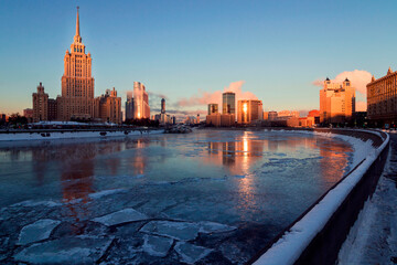 Buildings in the sunrise on a bank of the Moskva River. Winter morning