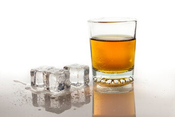 Whiskey with ice in glass