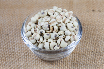 Millet rice in bowl on sackcloth.