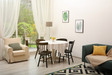 Dining table with chairs in living room. Interior design