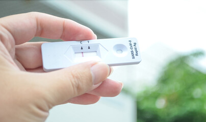 Hand Holding negative SARS-CoV-2 Rapid Antigen Test.COVID-19 rapid diagnostic test kit.COVID-19 test.corona virus test.delta covid.Lambda.