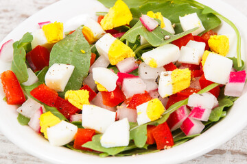 Fresh prepared salad in glass bowl, healthy nutrition concept