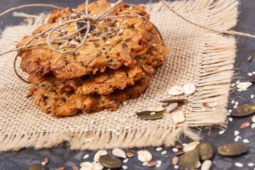 Fresh baked oatmeal cookies with honey and healthy seeds. Delicious crunchy dessert