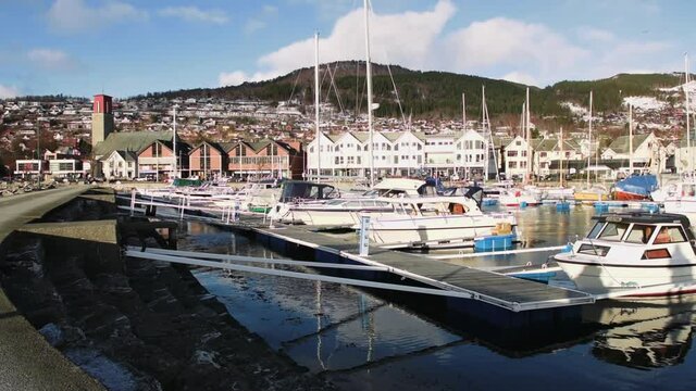 A beautiful view of a pier with boats in Volda, Norway