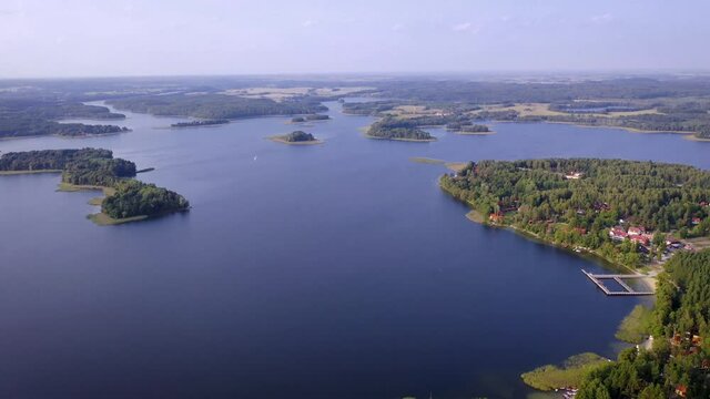 4K aerial video of Narie lake in Kretowiny village, Ilawa Lake District, in Warmia Mazury region of Poland