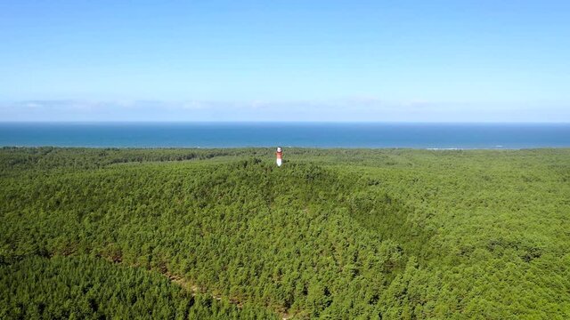4k drone aerial footage of Stilo Lighthouse in Osetnik village on the coast of the Baltic Sea in Poland